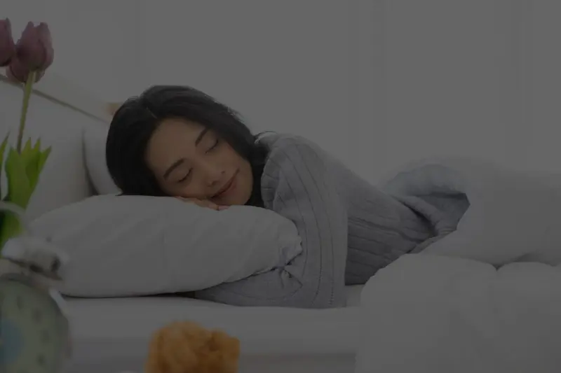 Calm bedroom scene representing better sleep hygiene for snoring and sleep apnea